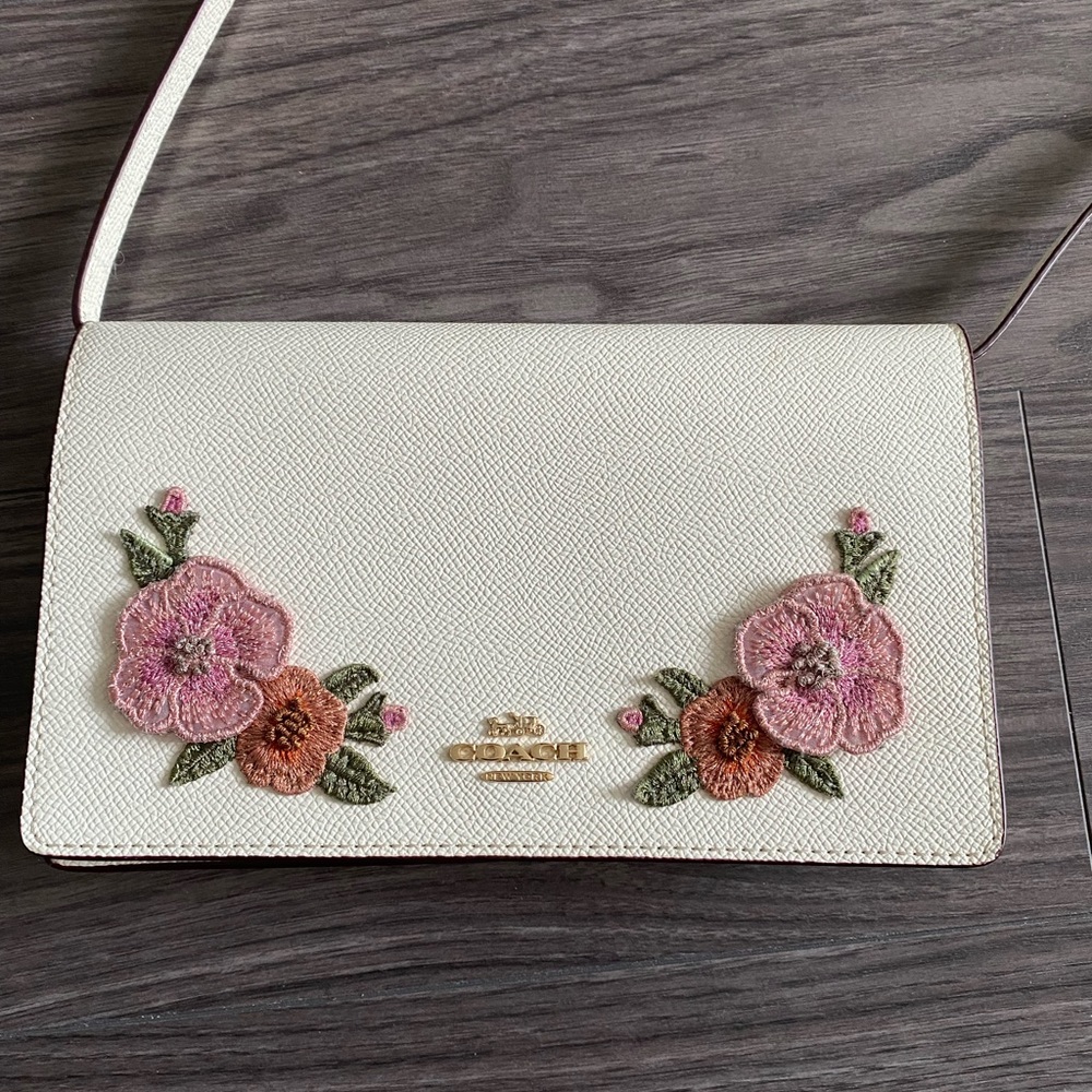 COACH floral white crossbody bag,burnt orange interior,gold hardware,never used